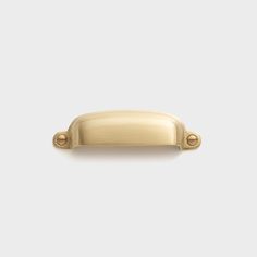 a gold door handle on a white background