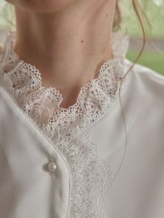 Color
White


Detail
Lace collar and placket; Two layers of openwork lace; Pearl buttons



Composition

100% Polyester



Washing Method

Hand wash in cool water, using a mild and gentle detergent. Elegant Lace Blouse For Daywear, Elegant Lace Work Blouse For Daywear, Elegant Lace Top For Day, Lace Button-up Blouse With Lace Cuffs, White Lace Blouse For Layering, Elegant Blouse With Lace Cuffs For Daywear, Elegant Lace Top With Lace Cuffs For Daywear, Elegant Button-up Blouse With Lace Top, Feminine Lace Button-up Blouse