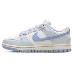 In colorway, the women’s Nike Dunk Low Next Nature “Blue Tint” sticks closely to the basics. Nearly two-toned in execution, the pair begins with a pristine white base, atop which sits a series of light blue overlays. And while the laces and outsole may match exactly, the Swoosh and accompanying logo hits opt for a slightly darker, albeit complementary cool tone. Cute Dunk Lows, Women’s Dunk Low, Nike Light Blue Shoes, Low Dunks Nike, Cute Dunks Low, Blue Tint Dunks Outfit, Dunk Low Bleu, Nike Blue Dunks, Dunks Light Blue