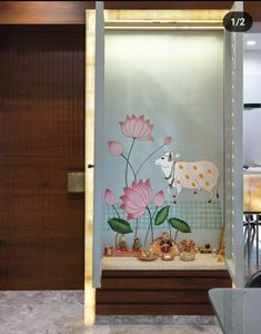 a glass display case with flowers and animals on the front door to a storefront