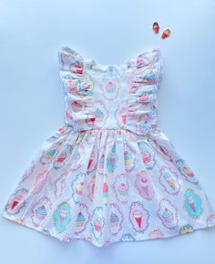 "The perfect cotton dress for girl. It is made of natural cotton, with ice cream print. The ruffles sewed with white cotton lace. Size information: age 0-3 months / height 22,05 \"- 22,83 '' (58-62 cm) / chest 17,72 '' (45 cm) age 3-6 months / height 26,77 '' (68 cm) / chest 19,29 '' (49 cm) age 6-9 months / height 29,13 '' (74 cm) / chest 20,08 '' (51 cm) age 9-12 months / height 31,5 '' (80 cm) / chest 20,87 '' (53 cm) age 12-18 months / height 33,86 '' (86 cm) / chest 21,86 '' (55 cm) age 2T Playful Ruffled Dresses For Vacation, Sweet White Dress With Ruffles, Sweet White Ruffled Dress, Summer Playtime Twirl Dress With Ruffle Hem, Summer Ruffle Dress For Playdate, Summer Twirl Dress With Ruffle Hem For Playtime, Playful Ruffled Short Sleeve Dress, Playful Short Sleeve Dress With Ruffles, Pink Summer Twirl Dress With Ruffles