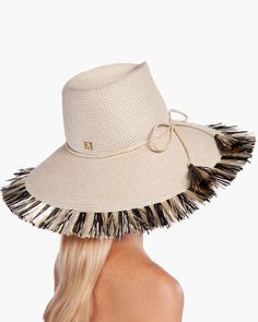 If you are looking for a woman's sun hat for sale online that is sure to turn heads, look no further! Named from the Caribbean Island that has endless beaches and warm turquoise water, this sun hat made of Squishee® is a show stopper. This flirty, tropical sun hat combines the pinched crown of a fedora with a wide brim, edged all around with glamorous straw fringe. Wherever your adventure, from St. Barths to Antibes, approving smiles are sure to follow! Squishee® straw is a sustainable man-made Tropical Sun, Hat Fedora, St Barths, Caribbean Island, Wide Brim Fedora, Straw Fedora, Turquoise Water, Hats For Sale, Fedora Hat