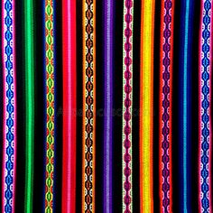 multicolored striped fabric is shown in this image, it looks like they have been made out of yarn