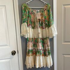 On Or Off The Shoulder Boho Floral Print Dress. She Is Beautiful For Summer. Right Armpits Seam Is A Hit Lose But Nothing That Cant Be Fixed. She’s Never Been Worn. Multicolor Long Sleeve Dress With Lace Trim, Multicolor Lace Trim Beach Dress, Green Lace Trim Dress For Brunch, Vacation Tunic Dresses With Lace Trim, Multicolor Peasant Dress For Spring, Peasant Style Floral Print Dress For Brunch, Spring Peasant Multicolor Dresses, Spring Multicolor Peasant Dresses, Flowy Multicolor Peasant Dress