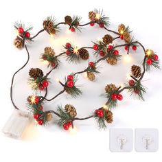 a christmas garland with pine cones and lights