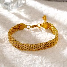 Highlights: Built To Withstand Everyday Wear, Hypoallergenic And Non-Tarnish Bracelet, Unisize, Waterproof Bracelet. This Elegant Everyday Mesh Bracelet Subtly Stands Out Drawing Beauty From Its Mere Simplicity. Crafted Out Of Rich 18k Yellow Gold On A Lightweight Non-Irritating Build To Ensure Your Everyday Bracelets Keep Up With Your Busy Everyday Lifestyle. Wear It As A Dainty Bracelet Whether You're Sporting It Out With Your Favorite Casual Tee And Jeans Or Layering It With Your Favorite Jew Everyday Yellow Gold Metal Chain Bracelet, Gold-tone Delicate Chain Metal Bracelet, Elegant Gold-tone Metal Bracelet, Gold-tone Brass Bracelet With Gold Chain, Elegant Brass Gold-tone Chain Bracelet, Everyday Bracelet, Gold Bracelet For Women, Mesh Bracelet, Dainty Bracelets