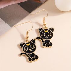 Bold drop earrings with spooky-cute design and a high-shine finish. 0.79" W x 1.57" L 18k gold-plated copper / enamel Lucky Black Cat, Best Selling Jewelry, Sailor Moon Cat, Kitten Earrings, Black Cat Earrings, Swarovski Crystal Drop Earrings, Hummingbird Earrings, Gold Bead Earrings, Luxe Jewelry