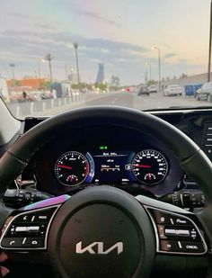 the interior of a car with dashboard and gauges