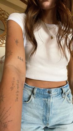 a woman with tattoos on her arm