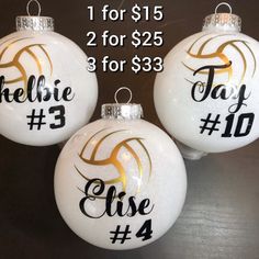 three white christmas ornaments with gold lettering on them for $ 15 or $ 25 each