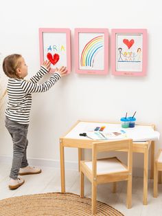 Showcase your little one's imagination and creativity with our elegant artwork display frame. Designed for convenience and accessibility, each frame can effortlessly hold multiple pieces of art or function as stylish wall decor. The interior of this easy-to-change artwork frame is sturdy, ensuring your child's masterpieces stay securely in place. Utilize the built-in hook of every white child artwork frame for easy display of your child's creations. Available in different colors, this versatile item complements any interior style. Whether hung as a portrait in the living room, bedroom, study, or office, it adds a touch of warmth and charm to any space. Crafted by hand from eco-friendly wood, our artwork display and storage frame is mom-approved for its non-toxic, indoor-safe materials. It Framing Kids Artwork Wall, Shiplap Kids Art Display, Kid Colorful Art Frames, Kids Artwork Storage, Kids Picture Frames, Frame Kids Art, Stylish Wall Decor, Elegant Artwork, Personalized Picture Frames