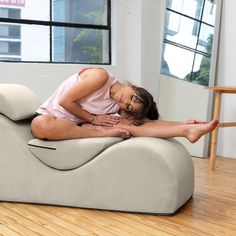 a woman is sitting on an inflatable couch