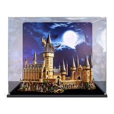 a model of hogwarts castle under a full moon