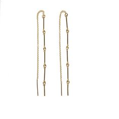 Description Our Golden Threader Earrings features 14kt gold-filled gold bar chain and delicate 14kt gold-filled chain to create this stunning threader earring. Details & Fit 14kt gold-filled chain bar chain 14kt gold-filled boy chain threader Style Number ETHR-5