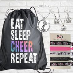 a black bag with the words eat sleep cheer repeat on it next to other items