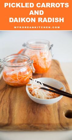 pickled carrots and daikon radish on a cutting board with chopsticks