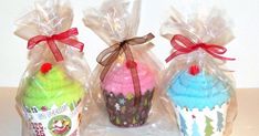 three small cupcakes wrapped in plastic bags