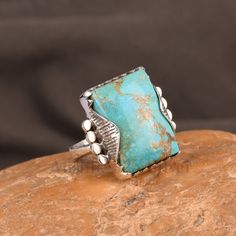 Add a heritage touch in your everyday look with this auspicious 925 sterling silver toned Fine Gemstone Ring with Kingman Turquoise. Makes a perfect indulgence so grab it today. Product & Gemstone Detail: Gemstone: Kingman Turquoise Stone Size: 14x20 Shape: Color: Blue Kingman Turquoise necklace https://www.etsy.com/shop/Anshik925Silver?ref=seller-platform-mcnav&search_query=necklace Kingman Turquoise Earrings https://www.etsy.com/shop/Anshik925Silver?ref=seller-platform-mcnav&search_query=Turqu Unique Multi-stone Turquoise Ring In Sterling Silver, Silver-setting Turquoise Cabochon Ring, Authentic Turquoise Jewelry, Gift Multi-stone Turquoise Ring In Sterling Silver, Nickel-free Blue Turquoise Ring In Sterling Silver, Unique Nickel-free Sterling Silver Turquoise Ring, Vintage Bohemian Style, Rings Bands, Wedding Party Jewelry