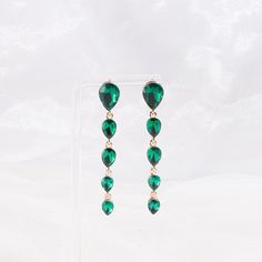 Get a feel for luxury in these flowing teardrop earrings that creates balance in your style. Size: - Length: 2.75 in (6.99 cm) x Width: 0.38 in 0.97 cm) Quality: - Multi-sized teardrop cut rhinestones and metal alloy backing to create a 5-tiered drop earring connected by links with a post backing. Imported Party Drop Linear Earrings, Teardrop Linear Earrings For Party, Party Teardrop Linear Earrings, Trendy Teardrop Chandelier Earrings For Party, Teardrop Earrings For Party, Long Drop Teardrop Earrings For Party, Long Drop Teardrop Party Earrings, Trendy Teardrop Earrings For Party, Single Teardrop Earring For Party