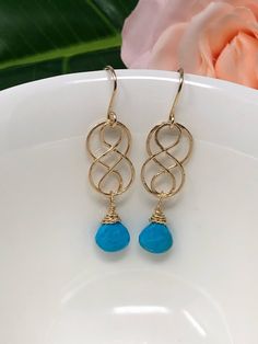 "Turquoise and gold are a perfect pairing. The cool aqua and warm gold provide an amazing contrast and elevate your wardrobe. Made with very fine quality turquoise and 14kt gold, these will be a favorite for years. Approximately 1.75 inches total length. *Some photos enlarged to show detail. 🍃 International Buyers, please provide your phone number in the \"note to seller\" section during checkout. It is important to add it to the customs form. 🍃 International buyers are responsible for ALL cus Hammered Gold Earrings, Turquoise Faceted Drop Earrings, Turquoise Teardrop Faceted Jewelry, Turquoise Teardrop Faceted Earrings, Turquoise Faceted Teardrop Earrings, Faceted Turquoise Teardrop Earrings, Elegant Turquoise Faceted Earrings, Elegant Faceted Turquoise Earrings, Turquoise Jewelry Gold