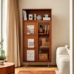 a living room filled with furniture and a book shelf