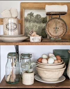 an old fashioned kitchen shelf with eggs and other items