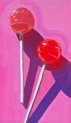 two lollipops on a pink background