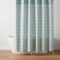 a shower curtain with blue and white circles on it