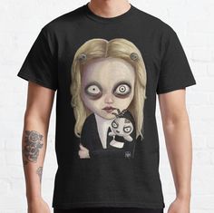 Standard fit with double-needle hems for durability. Solid colors are 100% preshrunk cotton, heather colors are cotton blend. Range of colors available, with the option to print on front or back. Size range S-3XL, suitable for men and women. fanart piece of Lenore, the little cute dead girl done digitally. Black Cotton Tops With Custom Artwork, Cotton Tops With Custom Band Artwork, Women Fanart, Dead Girl, Solid Colors, Classic T Shirts, Cotton Blend, Solid Color, For Men