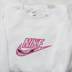 Introducing our Majin Buu x Nike Anime Embroidered Shirt, Dragon Ball Embroidered Shirt, and Nike Inspired Embroidered Shirt collection! Made with premium quality fabric, these shirts showcase intricate embroidery that brings your favorite anime characters to life. With a perfect blend of style and comfort, these shirts are a must-have for every anime enthusiast. The vibrant colors and attention to detail make these shirts truly unique, allowing you to express your love for anime in a fashionabl White Long Sleeve Shirt With Embroidered Logo, White Long Sleeve Shirt With Embroidered Graphics, White Long Sleeve Shirt With Machine Embroidery, White Embroidered Crew Neck Shirt, Casual Pink Embroidered Shirt, Pink Embroidered Cotton Shirt, White Crew Neck Shirt With Embroidered Logo, Nike Anime, Ball Nike