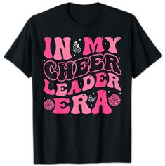 Fan Apparel T-shirt With Team Name For Cheerleading, Pink Team Spirit T-shirt With Team Name, Team Spirit Pink T-shirt With Team Name, Cheerleading Short Sleeve T-shirt With Letter Print, Pink School Spirit T-shirt With Name Print, Short Sleeve T-shirt With Letter Print For Cheerleading, Crew Neck T-shirt With Text Print For Cheerleading, Cheerleading Text Print Tops With Team Spirit, Pink Team Spirit T-shirt With Graphic Print