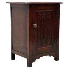 an old wooden cabinet with carvings and knobs on the front door, isolated against a white background