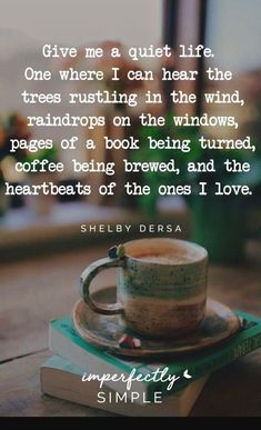 a coffee cup sitting on top of a stack of books with the quote give me a quiet life one where i can hear the trees rusting in the wind