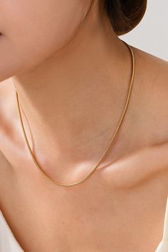 Introducing our golden snake chain, the perfect mix of simple and stylish! This necklace will add just the right amount of edge to any outfit. Upgrade your jewelry game with our stunning snake chain. Chain: 16" Ball chain clasp Gold plating Lead and nickel compliant Anti-tarnish Golden Snake, Dainty Chain Necklace, Outfit Upgrade, Gold Snake Chain, Pvd Coating, Gold Necklace Simple, Layered Chain Necklace, Sunglass Chain, Jewelry Simple