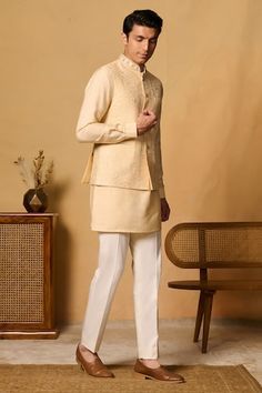 Yellow bundi with thread embroidered floral motifs and placed sequin bead embellishments. Comes with inner kurta and pant. - Aza Fashions Luxury Men's Nehru Jacket With Floral Embroidery, Semi-stitched Nehru Jacket With Intricate Embroidery, Embroidered Beige Nehru Jacket, Designer Long-sleeve Embroidered Nehru Jacket, Pink Embroidered Nehru Jacket Kurta, Beaded Neckline, Cocktail Reception, Nehru Jackets, Kurta With Pants