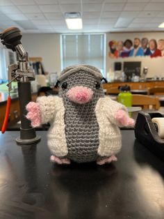 a small stuffed animal sitting on top of a table