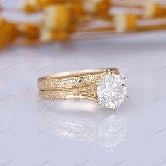 a gold ring with a diamond in the center