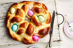 an easter bread with eggs in it on a table