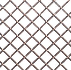 a close up view of a metal fence with diamond shaped bars on it's sides