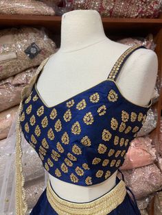 Navy blue plain lehenga with gold border teamed with beautiful cut dana and stone work blouse and contrasting ivory net dupatta. Fabric: Silk Occasion: Wedding Ceremony or Reception. WASH CARE INSTRUCTIONS - Please Dry clean only when it is applicable. Slight color variation is possible due to digital photography. This outfit can be customized in multiple colors and specific to client measurements. 120 days of production time is required and are for bulk orders only!Order are processed in store Blue Salwar Kameez With Gota Work For Reception, Blue Anarkali Set With Gota Work For Wedding, Royal Blue Sharara For Reception With Traditional Drape, Blue Floor-length Traditional Wear With Gota Work, Party Choli With Resham Embroidery In Royal Blue, Blue Blouse Piece With Gota Work For Diwali, Elegant Blue Choli With Cutdana, Elegant Blue Choli With Gota Work, Elegant Blue Anarkali Set With Unstitched Blouse