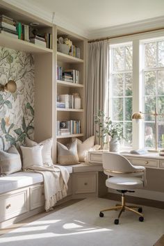 a room with a desk, chair and bookshelf filled with lots of books