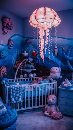 a baby's room decorated in blue and pink