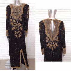 "Stunning black silk full length gown with black and gold beading. Made in almost a tunic style with round gold beads on the chest and sleeves. This dress is long to the floor, keyhole opening in the back, front split. In great condition all around. Made by the brand London, 100% pure silk, rayon lining, made in India, size medium. Shown on a size 6 , 5' 11\" mannequin, this dress is designed to fit relaxed and loosely. Size medium 25 inch sleeves 21 arm pit to arm 58 inches long 39 inch waist" Traditional Evening Dress For Gala Festivities, Traditional Evening Dress For Gala And Festive Season, Traditional Long Evening Gown, Black Bollywood Embellished Gown, Traditional Hand Embellished Evening Gown, Silk Embroidered Maxi Dress For Evening, Evening Embroidered Silk Maxi Dress, Traditional Embellished Evening Dress For Party, Traditional Embellished Evening Dress