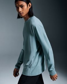 This stylish and comfortable crew is made for low-intensity activities and daily wear. With its roomy silhouette and minimalist design, the Movement Crew is an easy-to-wear essential that blends with any look. With side pockets for comfort. Breathable mesh slits on the sleeves add to the crew neck's sporty aesthetic. This standout design feature pairs perfectly with the Movement Joggers. Ribbing on the neckline, wrist cuffs and back hem give the crew neck a premium feel. A kissing edge runs alon Sporty Crew Neck Top With Side Pockets, Athleisure Tops With Pockets For Everyday, Athleisure Long Sleeve Top With Side Pockets, Long Sleeve Tops With Side Pockets For Athleisure, Long Sleeve Athleisure Top With Side Pockets, Casual Activewear With Thumbholes And Crew Neck, Sports Tops With Pockets And Crew Neck, Sportswear Tops With Pockets For Workout, Casual Activewear With Thumbholes