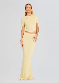 Upgrade your wardrobe in SER.O.YA's Kora Skirt. This chic mid-rise maxi skirt is crafted from a breathable knit fabric for ultimate comfort and style. Pair with the Clare Baby Tee for a co-ord look. Shown here in Butter. 39% Linen, 31% Cotton, 30% Nylon Made in China Model is 5'10" wearing size XS Style No. 3839-16 ABO Chic Spring Maxi Skirt For Loungewear, Chic Maxi Skirt For Loungewear, Chic Loungewear Maxi Skirt, Chic Ribbed Maxi Skirt For Spring, Spring Ribbed Stretch Maxi Skirt, Spring Stretch Ribbed Maxi Skirt, Fitted Ribbed Maxi Skirt For Spring, Fitted Ribbed Maxi Skirt, Bridal Reception Dress