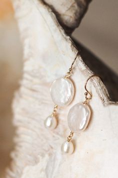 Elevate your bridal look with our handmade boho bridal earrings, featuring exquisite coin pearl drops. These dainty freshwater pearl earrings are the perfect blend of elegance and charm, making them ideal for weddings or any special occasion. Meticulously crafted with attention to detail, they offer a unique touch to your ensemble, from classic, to contemporary, to boho, their simplicity means they are versatile enough to complement any style. The perfect pair of dainty pearl earrings. Matching Handmade Pearl Earrings, Delicate Pearl Jewelry, Handmade Pearl Jewelry, Pearl Earrings Designs, Pearl Earrings Handmade, Coin Pearl Earrings, Freshwater Pearl Jewelry, Pearl Earrings Wedding, Bridal Earrings Pearl