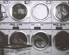 a laundry machine with several washing machines in it