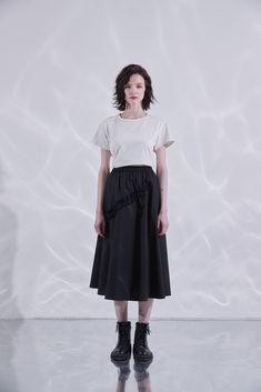 This Asymmetric Ruffle Midi Skirt is a fast pick for easy everyday style. It features a high-rise fit cut in an a-line silhouette, an elastic waist, and two side pockets. The fashionable ruffle top detail has an adjustable feature for a custom fit. Its quality craftsmanship is made of 55% Tencel, 45% Cotton and fully lined with cotton for comfort. Put it on and look great - not a fuss or a fight. High rise Easy elastic waist Two side pockets Ruffle top with adjustable detail Full cotton lining ( Modern Asymmetrical Hem Bottoms For Spring, Spring Asymmetrical Pleated Skirt, Spring Pleated Asymmetrical Flowy Skirt, Spring Flowy Asymmetrical Pleated Skirt, Modern Flared Skirt For Spring, Spring Asymmetrical Gathered Skirt Bottoms, Spring Asymmetrical Relaxed Pleated Skirt, Asymmetrical Gathered Skirt Bottoms For Spring, Modern Skirt With Asymmetrical Hem For Spring