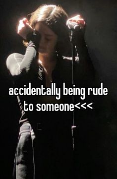 a woman singing into a microphone with the words accidentally being rude to someone > >