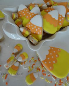 decorated cookies in the shape of umbrellas on a table